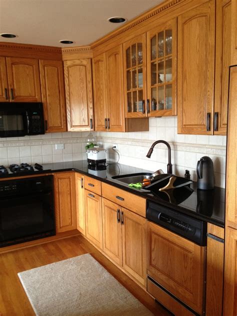 black stainless steel appliances oak cabinets|update golden oak cabinets.